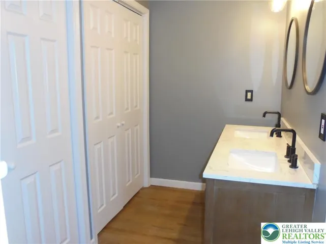 En Suite Master Bath w/ His & Her Double Door Closets and Double Sink Vanity