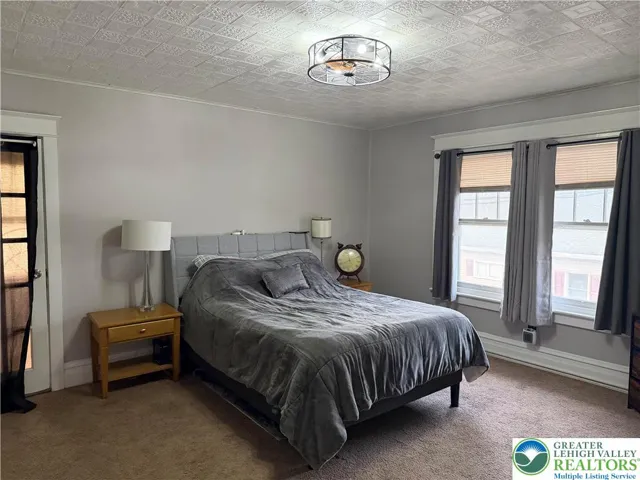 15x13 Primary bedroom with adjoining sunroom