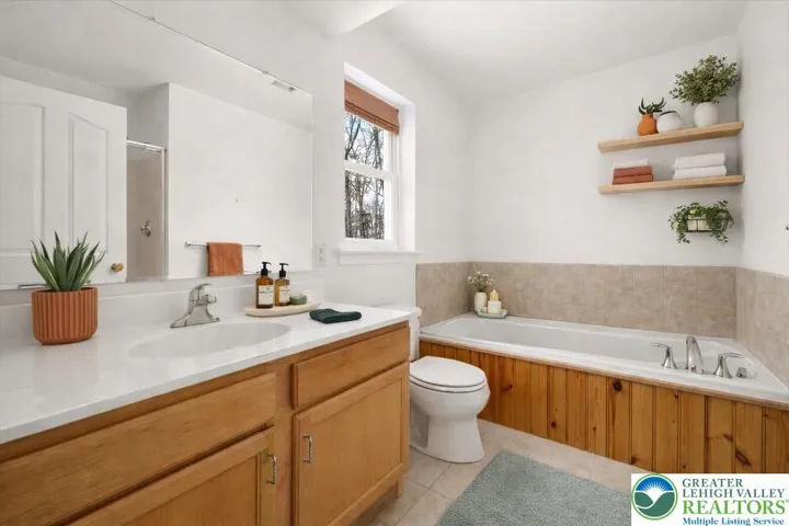 **virtually staged primary bath**
