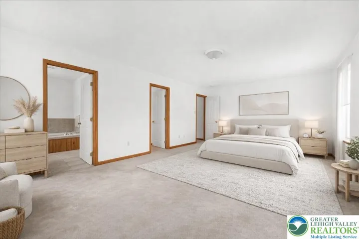 **virtually staged primary bedroom**