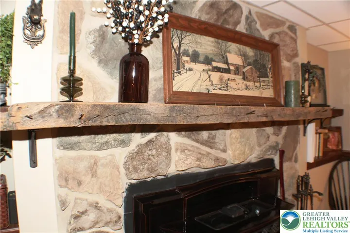 Stone chimney with mantel - makes the space.