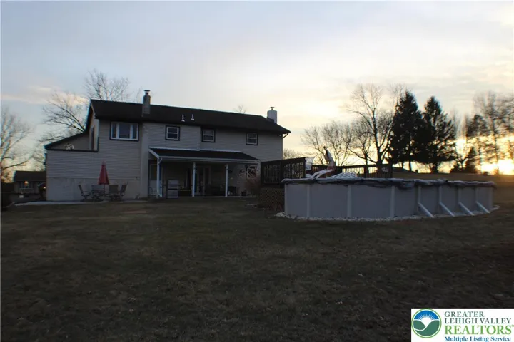 Covered Patio, with paver patio exension, and above ground pool