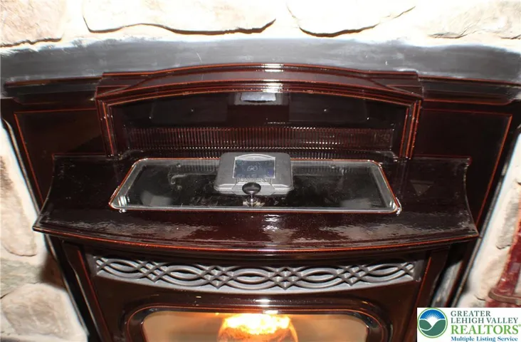 Stove is a great addition to the home - cheat heat in the cold winter months & makes for a toasty family room.