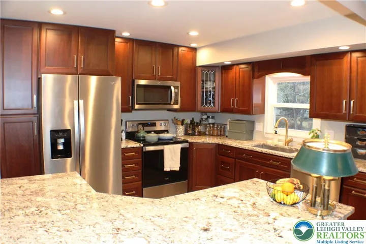 Solid wood cabinets and stainless appliances.