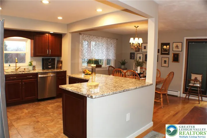 The Kitchen is updated and open to the Living and Dining rooms