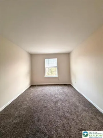 Additional bedroom offering flexibility for guests, work, or everyday use.