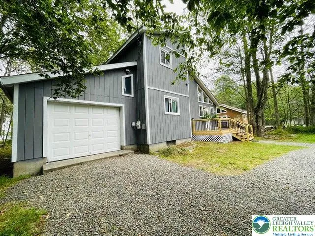 An oversized garage offers room for vehicles, tools, and hobbies, with a spacious attic area perfect for keeping things organized and out of sight. The electric opener makes coming and going effortless.
