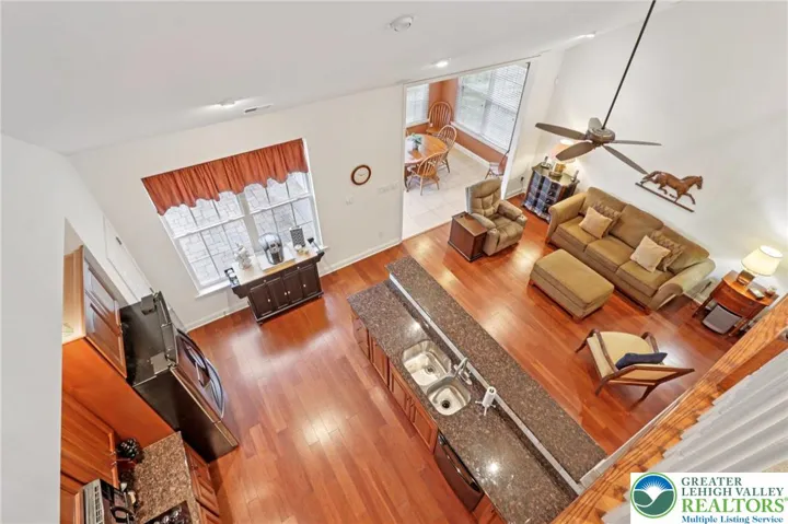 Birds eye view from second floor overlooking kitchen and FR