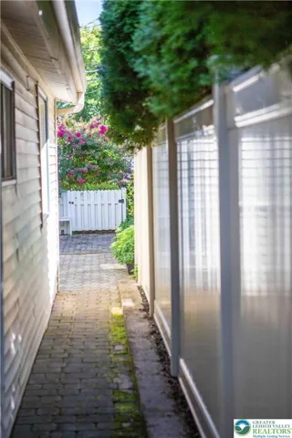 Back outside, connecting the front patio to the rear entertaining space.