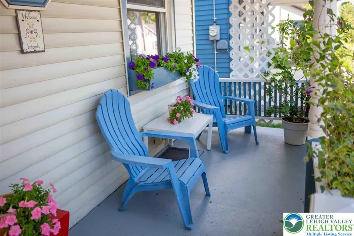Spacious covered front porch to enjoy your neighbors strolling by