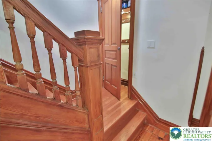 Vintage charm on the stairs plus convenient coat closet w/automatic light