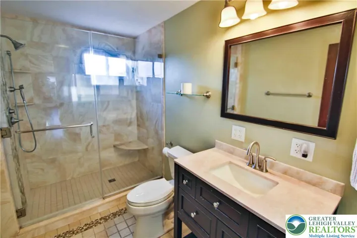 GORGEOUS 2nd floor full bathroom; tile, glass shower door, lots of natural light.
