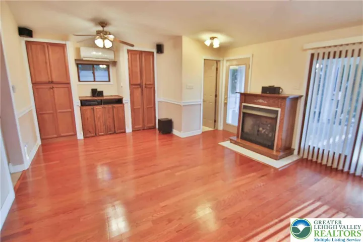 Family room w/built-in cabinetry and mini-split