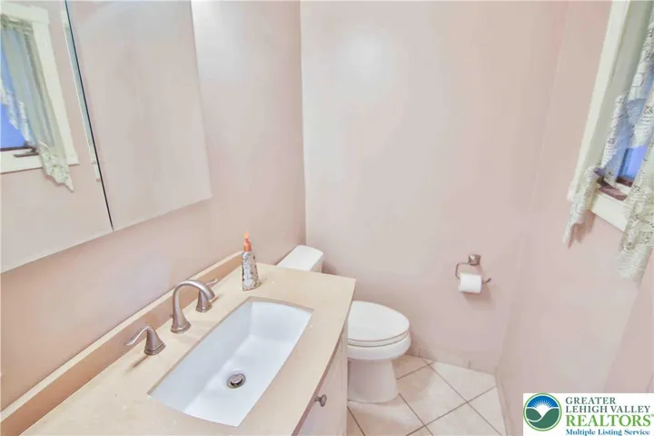 Half bath off Family Room w/easy access to back patio.