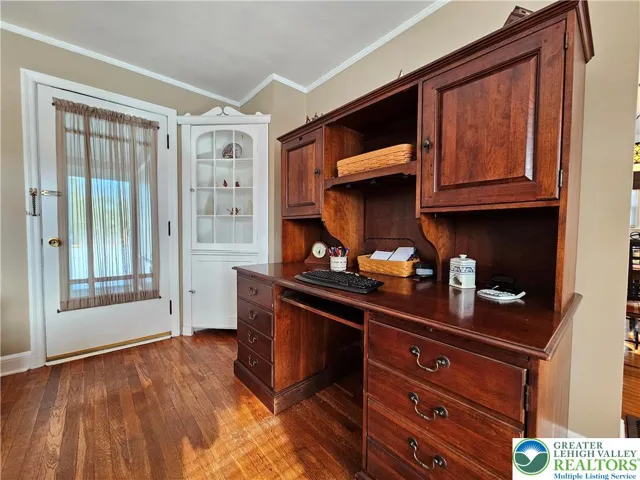 Living room - corner cupboard and door to sunroom