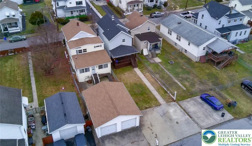 Aerial view showing home placement and nearby surroundings