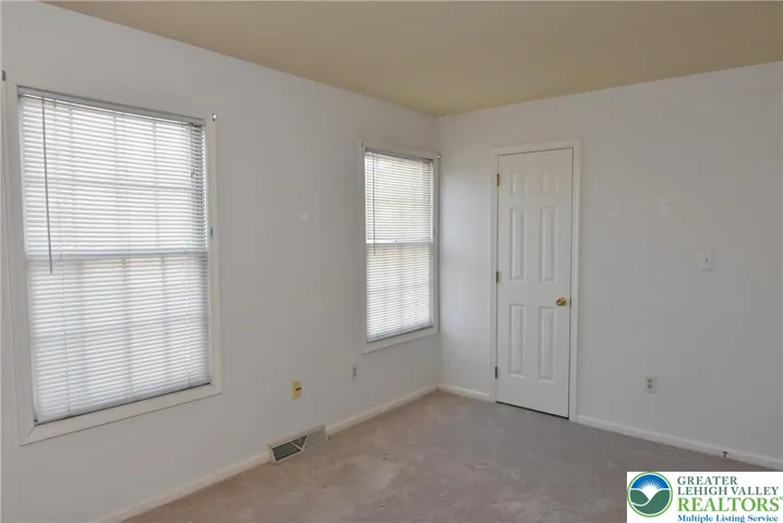 2nd Bedroom with windows overlooking pond