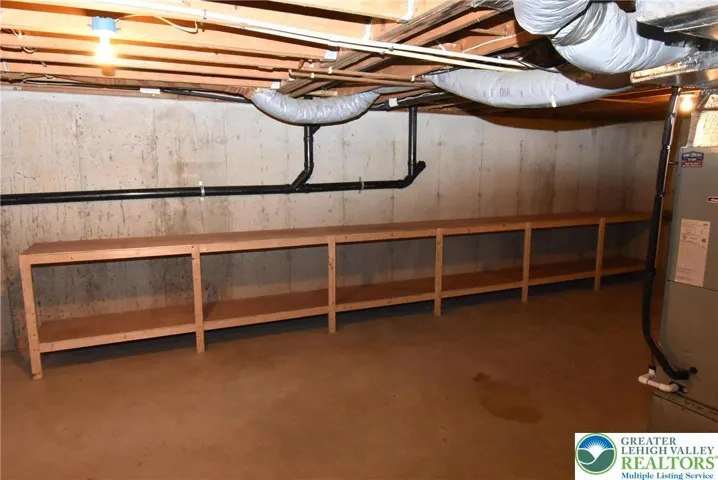 Full basement with lots of shelves