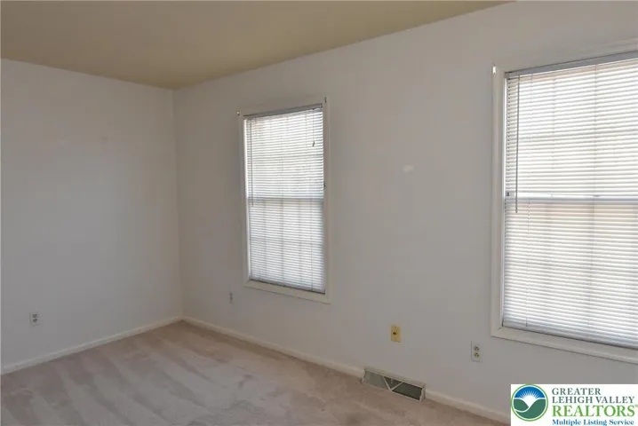 2nd Bedroom with windows overlooking pond