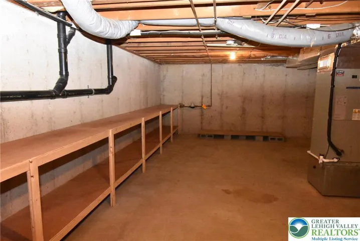 Full basement with lots of shelves