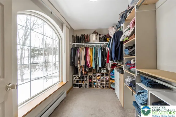 Primary Bedroom Walk- in Closet.