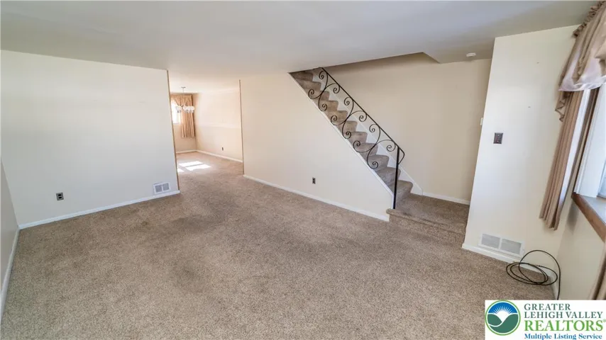 Hardwood floors are believed to be under the carpet