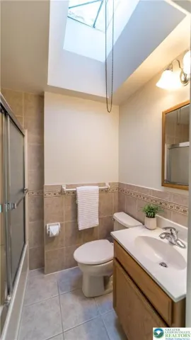 Full bath with tub/shower and glass sliding doors