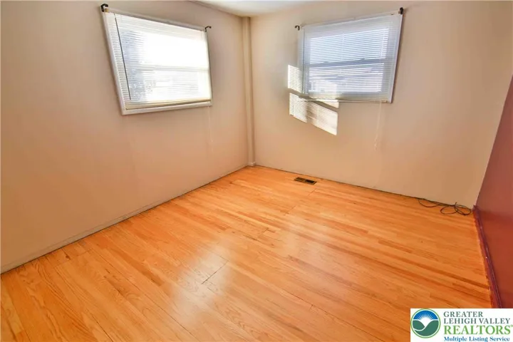 Bedroom #2 with wood floorings