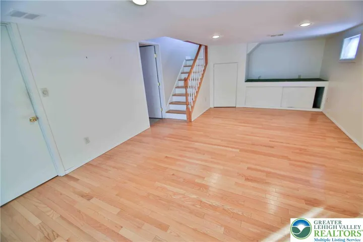 Engineered wood floors flow through this expansive Family Room