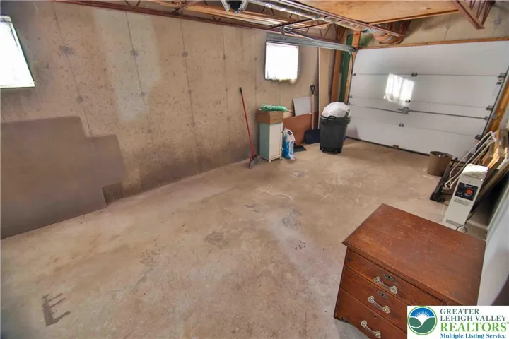 Long 1 car garage allows for plenty of storage