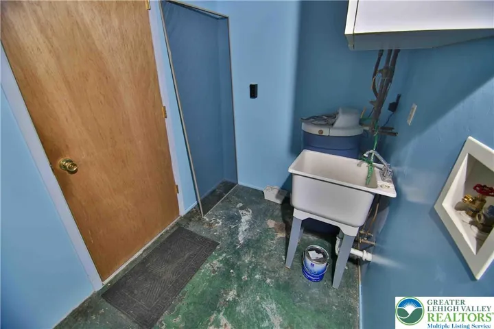 Utility sink, washer & dryer hook-ups; door leads to garage