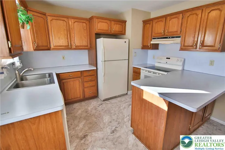Breakfast bar in this charming kitchen