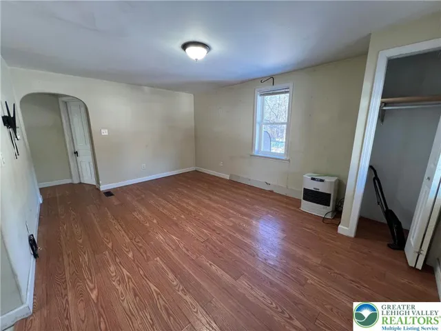 living room with wall oil heater