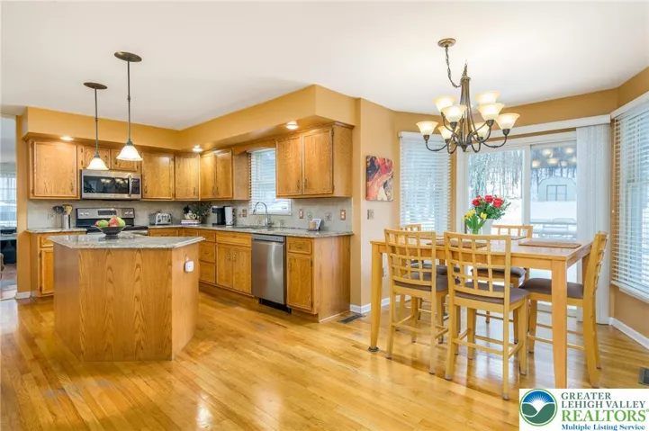 Great eating area in kitchen with nice backyard views of pool and grounds.