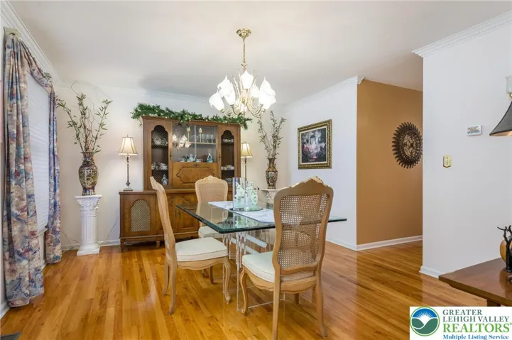 The dining room conveniently connects to the kitchen with a lovely butler's pantry with sink, cabinets and granite counter.