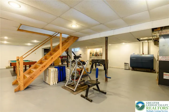 Welcome to the basement:  electric baseboard heat; already drywalled with a drop ceiling.  Start planning the man-cave!  Movie room?