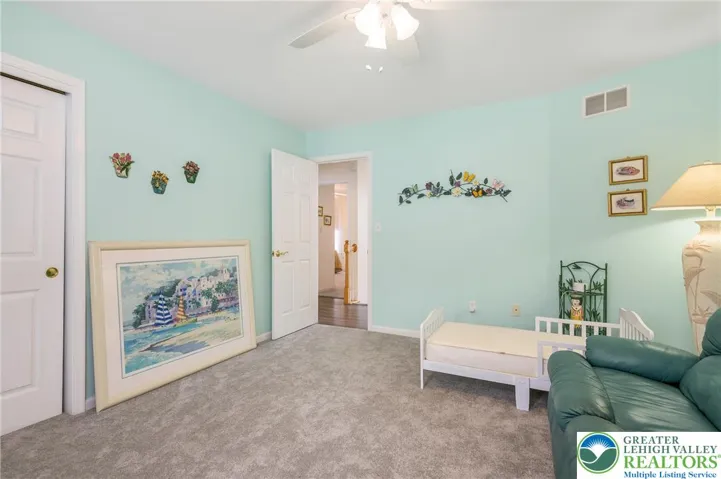 Bedroom #3.  Newer carpet. Ceiling fan.