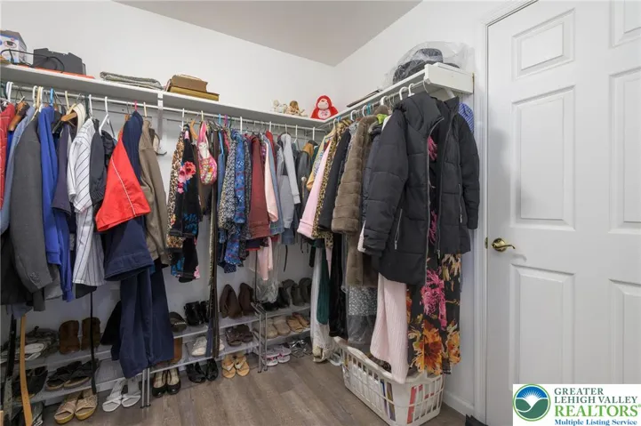 Walk-in closet.  The door leads to the so very convenient, massive storage space.