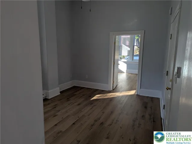 Entry door, living room toward bedroom.