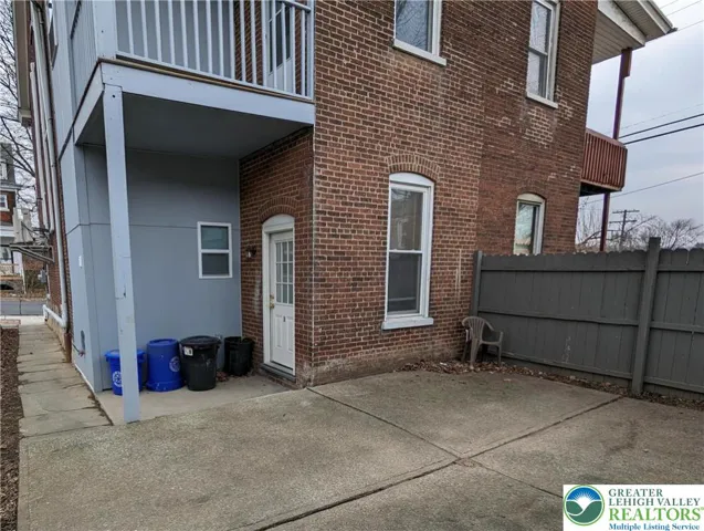 Covered area of patio, door to Unit 1.