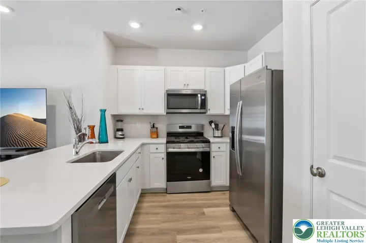 Undermount sink, gas cooking, and separate pantry too!