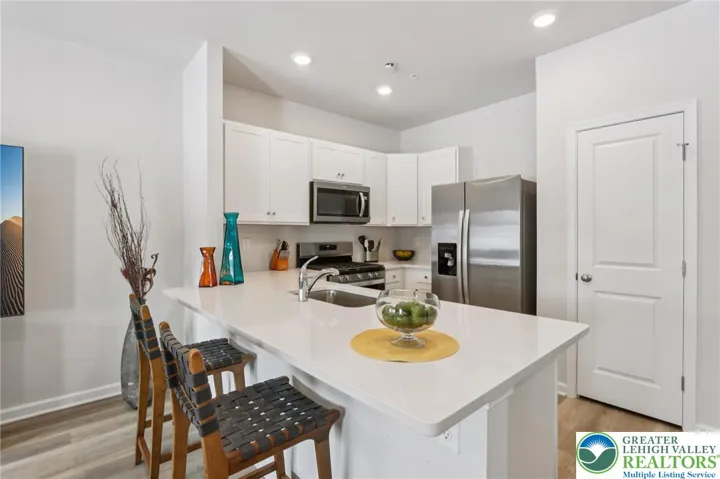 Modern convenience, pristine condition. Window treatments included.