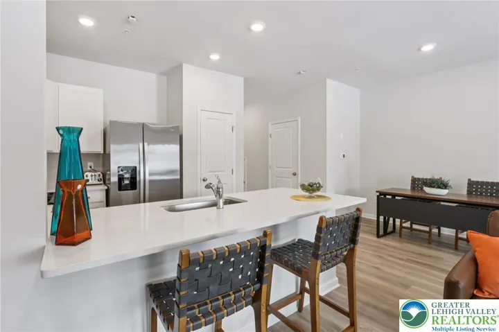 Quartz countertops, stainless appliances. Refrigerator included.