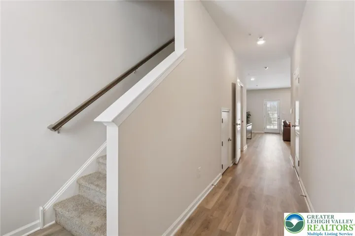 Wide carpeted steps to the 2nd floor.