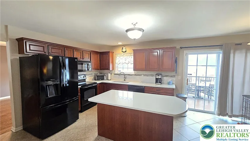 Kitchen with tile floor and backsplash