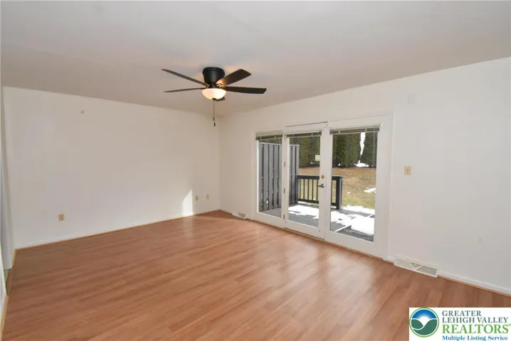 Living room has French doors to deck