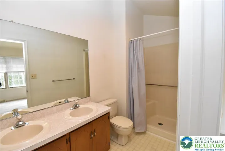 Primary Bath with dual vanity sinks and shower