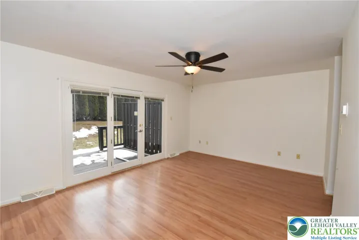 Living room has French doors to deck