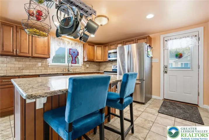 Center Island Breakfast Bar, Granite Counters, Soft-close doors and drawers
