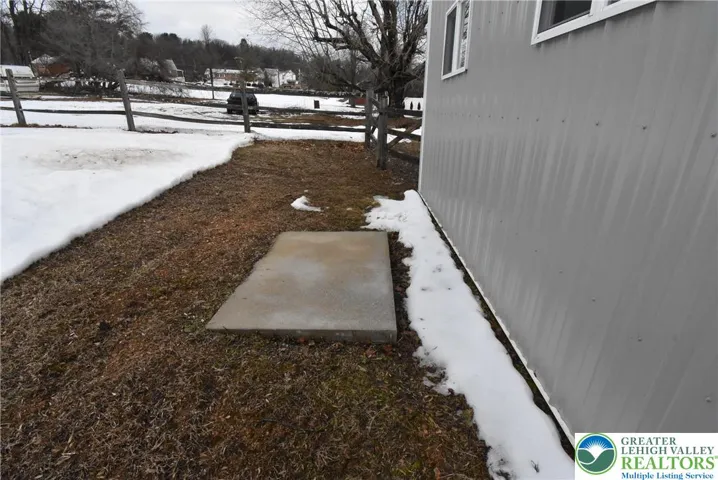 Concrete pad behind garage may be used for future generator or HVAC